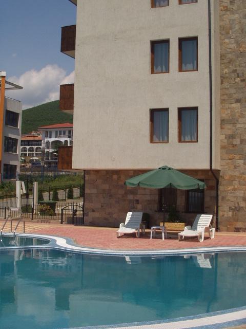 The apartment balcony is the second one up