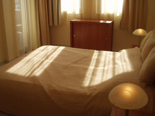 Door to balcony from the bedroom at top left