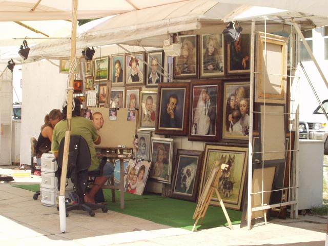 Street artists and lots of them - will paint a posed portrait or from a photograph